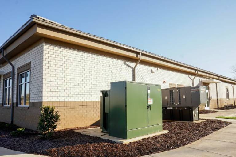 a building with a green power generator