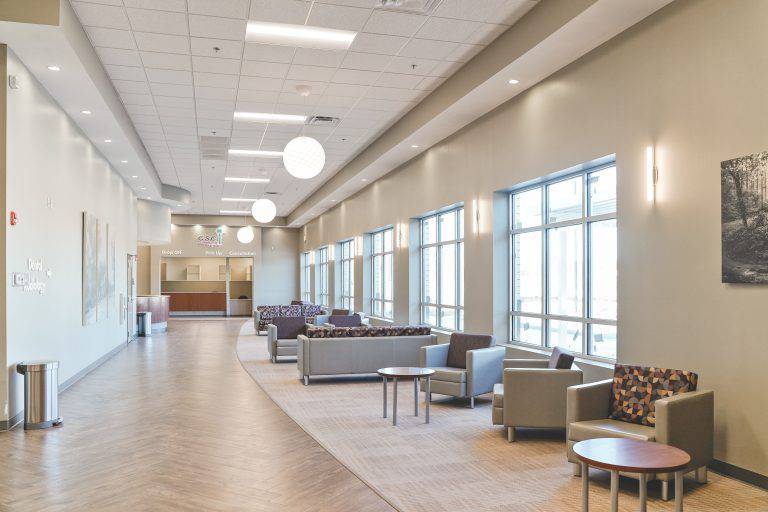 a large lobby with couches and chairs