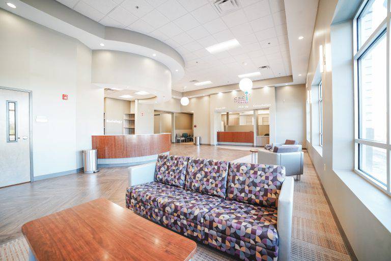 a lobby with couches and a large window